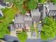 Aerial view of townhomes with lush landscaping, hardscaped patios, and visible parking at 113 Spring Cove Dr, Cary, NC 27511