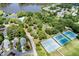 Aerial view highlighting tennis courts, community amenities, and neighborhood layout at 113 Spring Cove Dr, Cary, NC 27511