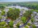 Breathtaking aerial view of a lakeside community surrounded by lush green trees and beautiful homes at 113 Spring Cove Dr, Cary, NC 27511