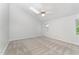 Bright bedroom with vaulted ceiling, neutral carpet, and ample natural light from two windows for a cozy space at 113 Spring Cove Dr, Cary, NC 27511