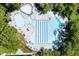 Aerial view of large community pool with lap lanes, slide, and sunbathing areas at 113 Spring Cove Dr, Cary, NC 27511