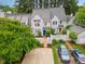 Beautiful townhome with a blue door, fenced in yard, and lush landscaping at 113 Spring Cove Dr, Cary, NC 27511