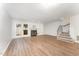 Spacious finished basement with a fireplace, built-in shelves, and french doors leading to the outdoors at 113 Spring Cove Dr, Cary, NC 27511
