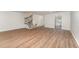 Bright and spacious living room with hardwood floors, stairs and access to a kitchen for easy entertaining at 113 Spring Cove Dr, Cary, NC 27511