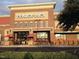 Trader Joe's storefront with seasonal displays and customer activity at 113 Spring Cove Dr, Cary, NC 27511