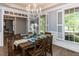 Elegant dining room with ample natural light perfect for Gathering gatherings and dinner parties at 124 Creekvista Dr, Holly Springs, NC 27540