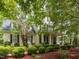 Charming two-story home with meticulous landscaping, creating a welcoming and picturesque setting at 124 Creekvista Dr, Holly Springs, NC 27540