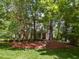 Beautiful two-story home featuring lush landscaping and inviting front porch, perfect for relaxing at 124 Creekvista Dr, Holly Springs, NC 27540