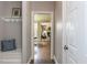 Hallway with bench seating that leads to a living room with lots of natural light at 124 Creekvista Dr, Holly Springs, NC 27540