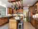 Spacious kitchen featuring granite countertops, center island, and ample storage space for culinary enthusiasts at 124 Creekvista Dr, Holly Springs, NC 27540