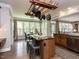 Bright kitchen offers natural light, center island seating, and seamless flow to the dining area at 124 Creekvista Dr, Holly Springs, NC 27540
