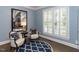 Cozy living room boasts natural light and stylish decor, creating a relaxing atmosphere at 124 Creekvista Dr, Holly Springs, NC 27540