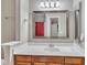 This bathroom features a sink, mirror, and wooden vanity cabinet for a traditional look at 134 Riverwalk Cir, Cary, NC 27511