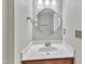 Cozy half-bathroom with modern sink and decorative wall mirror at 134 Riverwalk Cir, Cary, NC 27511