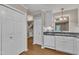 Well-maintained kitchen featuring sleek countertops, white appliances, and ample storage space at 134 Riverwalk Cir, Cary, NC 27511