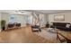 Inviting living area with hardwood floors, a cozy couch, and open access to the dining area at 134 Riverwalk Cir, Cary, NC 27511