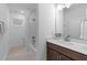 Bathroom featuring white countertops, dark wood cabinets, and a shower with a tub at 143 Swain St, Clayton, NC 27527