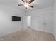 Bedroom featuring a ceiling fan and ample closet space at 143 Swain St, Clayton, NC 27527