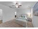 Bright bedroom with a ceiling fan, white walls, and a comfortable bed with stylish accents at 143 Swain St, Clayton, NC 27527