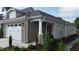 Charming home exterior with a brick accent wall, landscaped yard, and an inviting entrance at 143 Swain St, Clayton, NC 27527