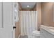 Cozy bathroom featuring a granite countertop vanity and shower with curtain at 1503 Laughridge Dr, Cary, NC 27511