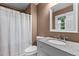 Cozy bathroom featuring a granite countertop vanity and shower with curtain at 1503 Laughridge Dr, Cary, NC 27511