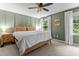 Relaxing bedroom featuring a king size bed, wood trim, and soothing sage green walls at 1503 Laughridge Dr, Cary, NC 27511