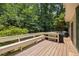 Spacious wooden deck offering ample room for outdoor grilling and entertaining amidst lush greenery at 1503 Laughridge Dr, Cary, NC 27511