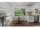 A well-lit kitchen nook with natural light that highlights stainless steel appliances and wooden accents at 1503 Laughridge Dr, Cary, NC 27511