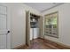 Convenient laundry area with washer, dryer, storage shelves, a window, and stylish flooring at 1503 Laughridge Dr, Cary, NC 27511