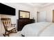 Comfortable bedroom features a dresser with mirror and a relaxing rocking chair at 1528 Anthology Dr, Durham, NC 27703