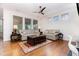 Comfortable living room with hardwood floors, a ceiling fan, and ample natural light at 1528 Anthology Dr, Durham, NC 27703