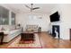 Cozy living room with a fireplace, hardwood floors, and comfortable seating area at 1528 Anthology Dr, Durham, NC 27703