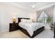 Comfortable primary bedroom with a ceiling fan, large windows, and neutral decor at 1528 Anthology Dr, Durham, NC 27703