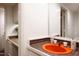 Bathroom featuring orange sink, brown tiled countertop, and white walls at 1604 Pinecrest Rd, Durham, NC 27705