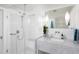 Sleek bathroom with glass shower, marble countertop, and modern fixtures at 1604 Pinecrest Rd, Durham, NC 27705