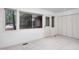 Bedroom showcasing large windows, natural light, and closet doors at 1604 Pinecrest Rd, Durham, NC 27705