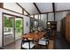 The dining area boasts hardwood floors and a sliding glass door to the outdoor deck at 1604 Pinecrest Rd, Durham, NC 27705