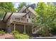 Exterior view showcasing deck and elevated architecture of the home at 1604 Pinecrest Rd, Durham, NC 27705