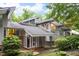 Striking modern home with unique architectural details, skylights, and professional landscaping for incredible curb appeal at 1604 Pinecrest Rd, Durham, NC 27705