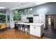 Bright kitchen with an island, stainless steel appliances, and a clear view of the outdoors at 1604 Pinecrest Rd, Durham, NC 27705