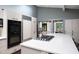 Modern kitchen with stainless steel appliances, skylight, and a view of the dining area at 1604 Pinecrest Rd, Durham, NC 27705