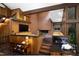 Inviting living room features a brick fireplace, wooden details, and seamless transition between spaces at 1604 Pinecrest Rd, Durham, NC 27705