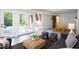 Open-concept living area with backyard access and a view into a game room at 1604 Pinecrest Rd, Durham, NC 27705
