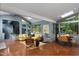 Well-lit living room featuring an open floor plan, a charming breakfast nook, and large windows at 1604 Pinecrest Rd, Durham, NC 27705