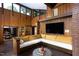 Unique living room featuring wood paneling, an ample seating area, and large windows at 1604 Pinecrest Rd, Durham, NC 27705