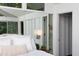 Bright and open main bedroom with closet and mirrored wall at 1604 Pinecrest Rd, Durham, NC 27705