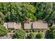 Aerial view of townhome community with lush trees at 17 Crystal Oaks Ct, Durham, NC 27707