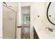 Modern bathroom with a shower, updated vanity, and views to the bedroom at 17 Crystal Oaks Ct, Durham, NC 27707