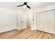 Bedroom featuring wood-look floors, a ceiling fan, and a closet at 17 Crystal Oaks Ct, Durham, NC 27707